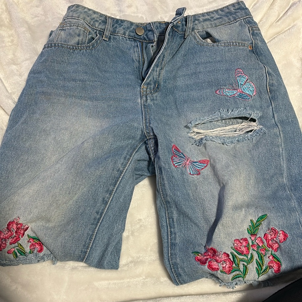 Butterfly and flower ripped jeans